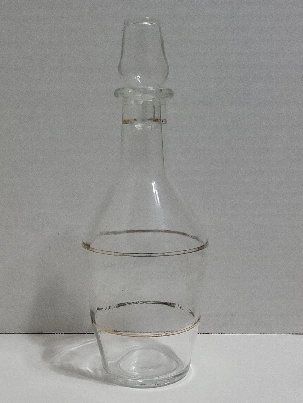 Clear Glass Decanter with Gold Accent and Leaf Etching.